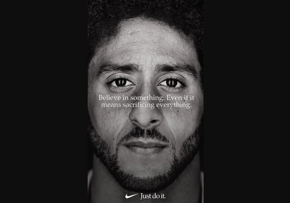 Nike ad featuring a black and white photo of a man with a beard that captures attention with its striking simplicity.
