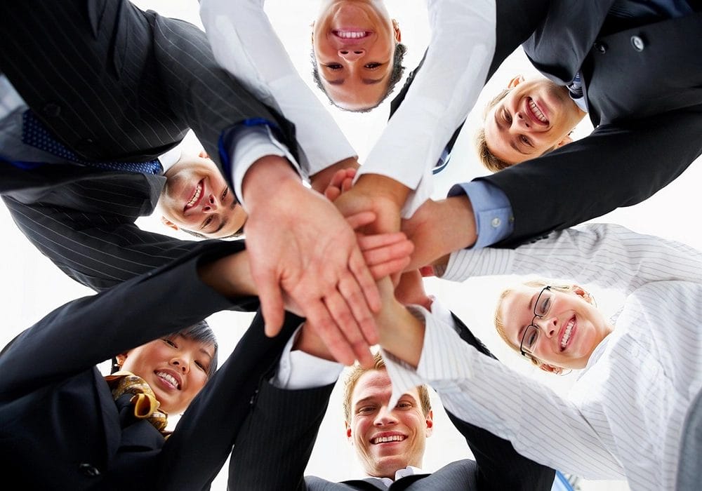 A group of people forming a million-dollar business.